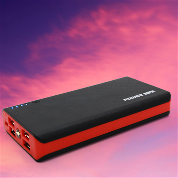 Black and red power bank against a pink and purple sky