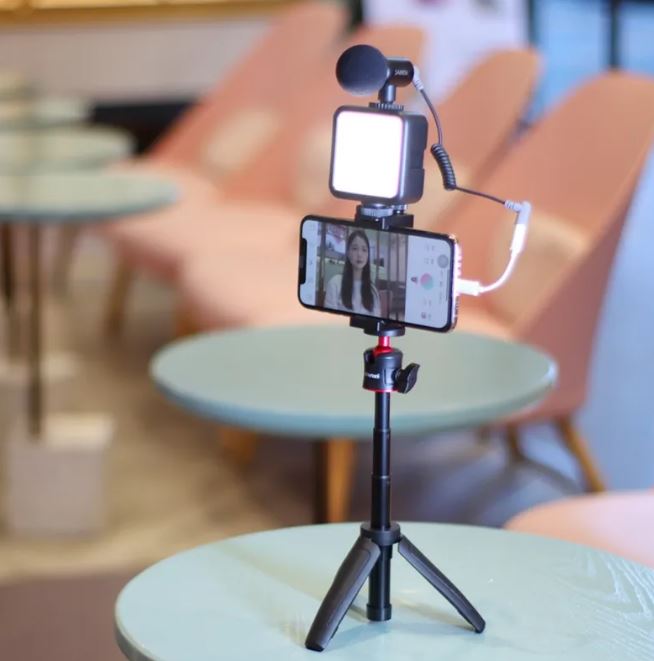 Mobile Phone Vlog Selfie Stick sitting on a side table ready to go