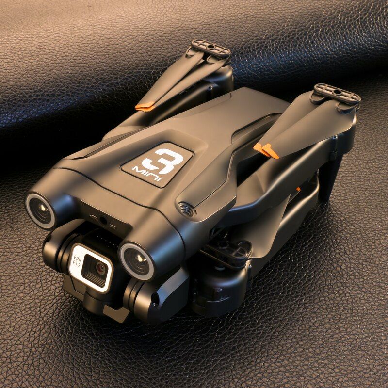 Black drone with '9' logo on a dark textured surface
