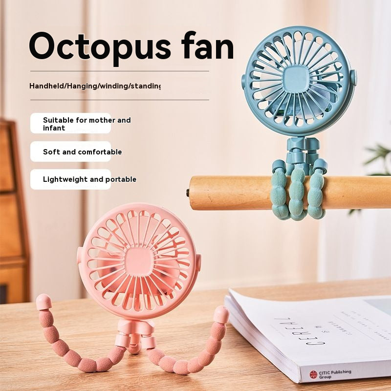 Two octopus-shaped fans, one pink and one blue, on a wooden surface with a blurred background.