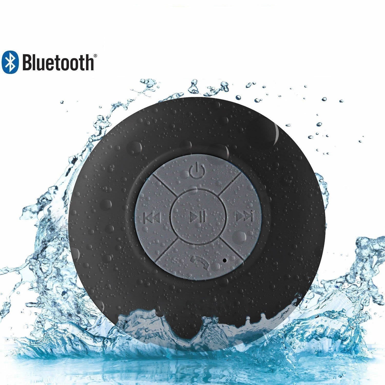 Black Bluetooth speaker with water splashes on a white background