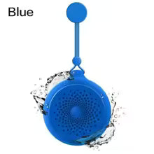 Blue portable speaker with water splashes on a white background