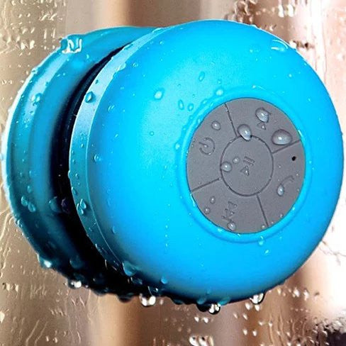 Blue shower speaker with water droplets on a bathroom background