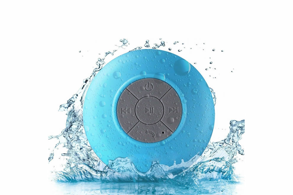 Blue waterproof shower speaker with water splashes on a white background