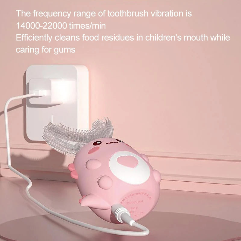 Pink children's toothbrush with a light on a pink background