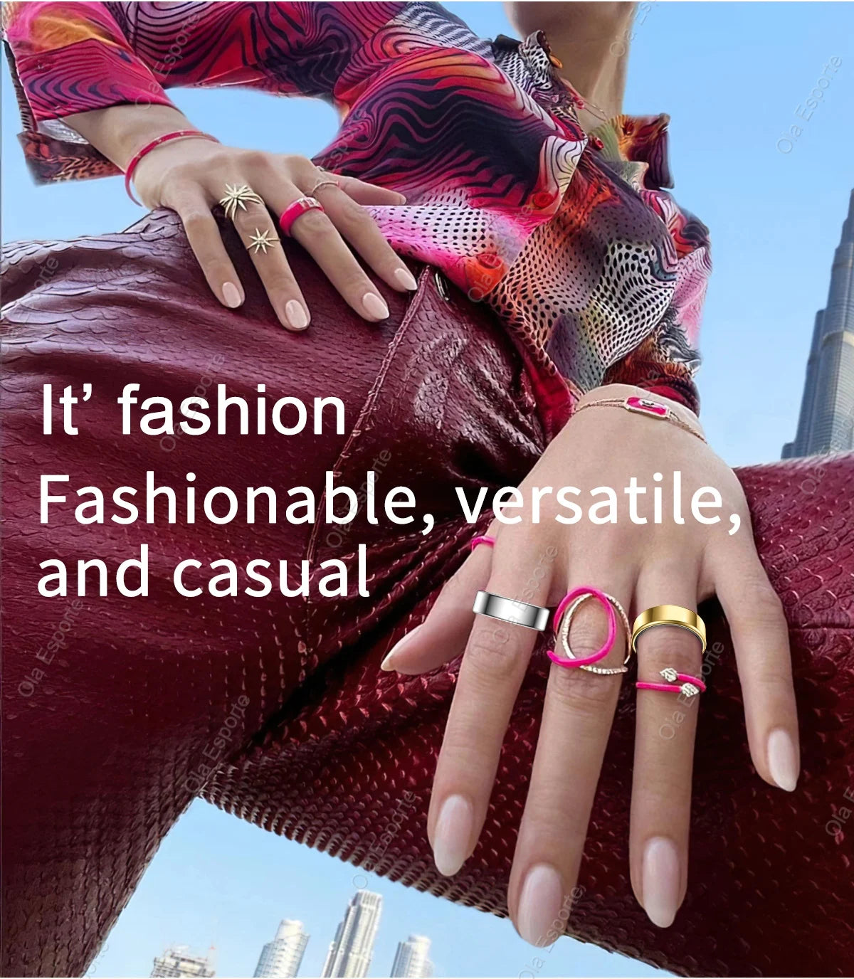 Close-up of hands wearing multiple rings with text 'It's fashion, Fashionable, versatile, and casual' against a cityscape background.