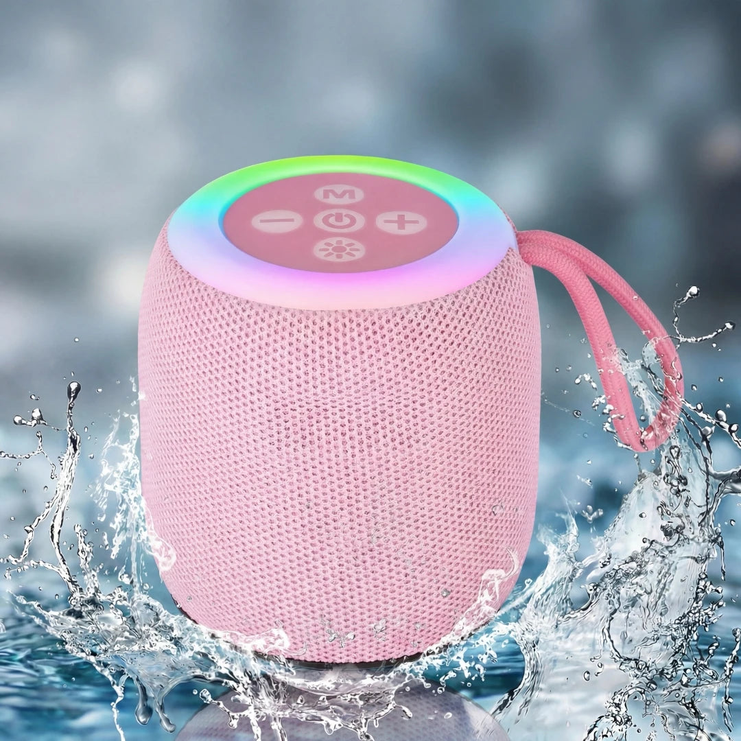 Pink portable speaker with colorful LED top in water