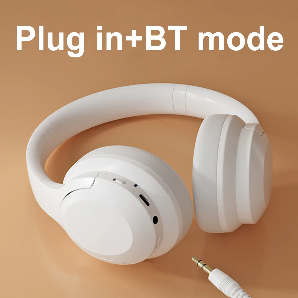White headphones with a cable on an orange background, labeled 'Plug in + BT mode'.