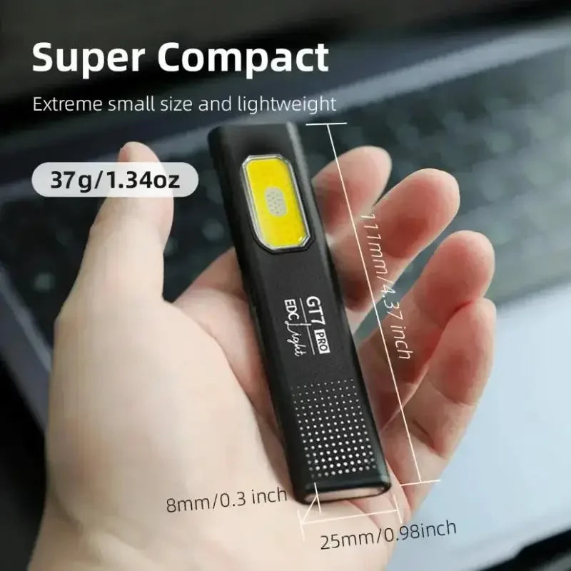 Compact flashlight held in a hand with measurements and weight displayed