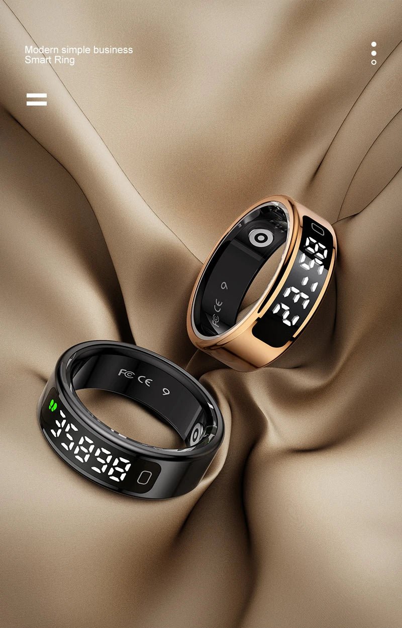 Two smart rings with digital displays on a beige fabric background