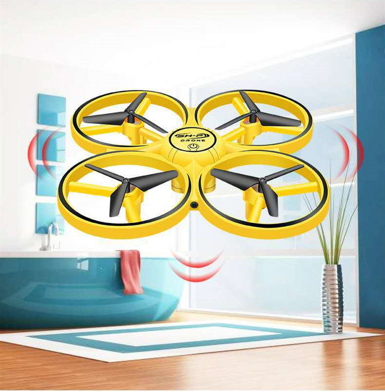 Yellow drone with black propellers in a room setting