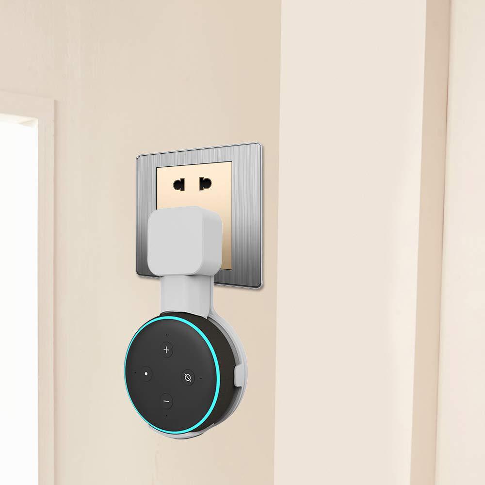 Smart home device attached to a wall socket on a beige background