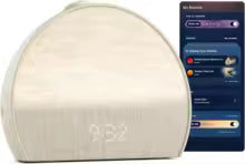 White sleep aid device with smartphone displaying a sleep tracking app on a white background