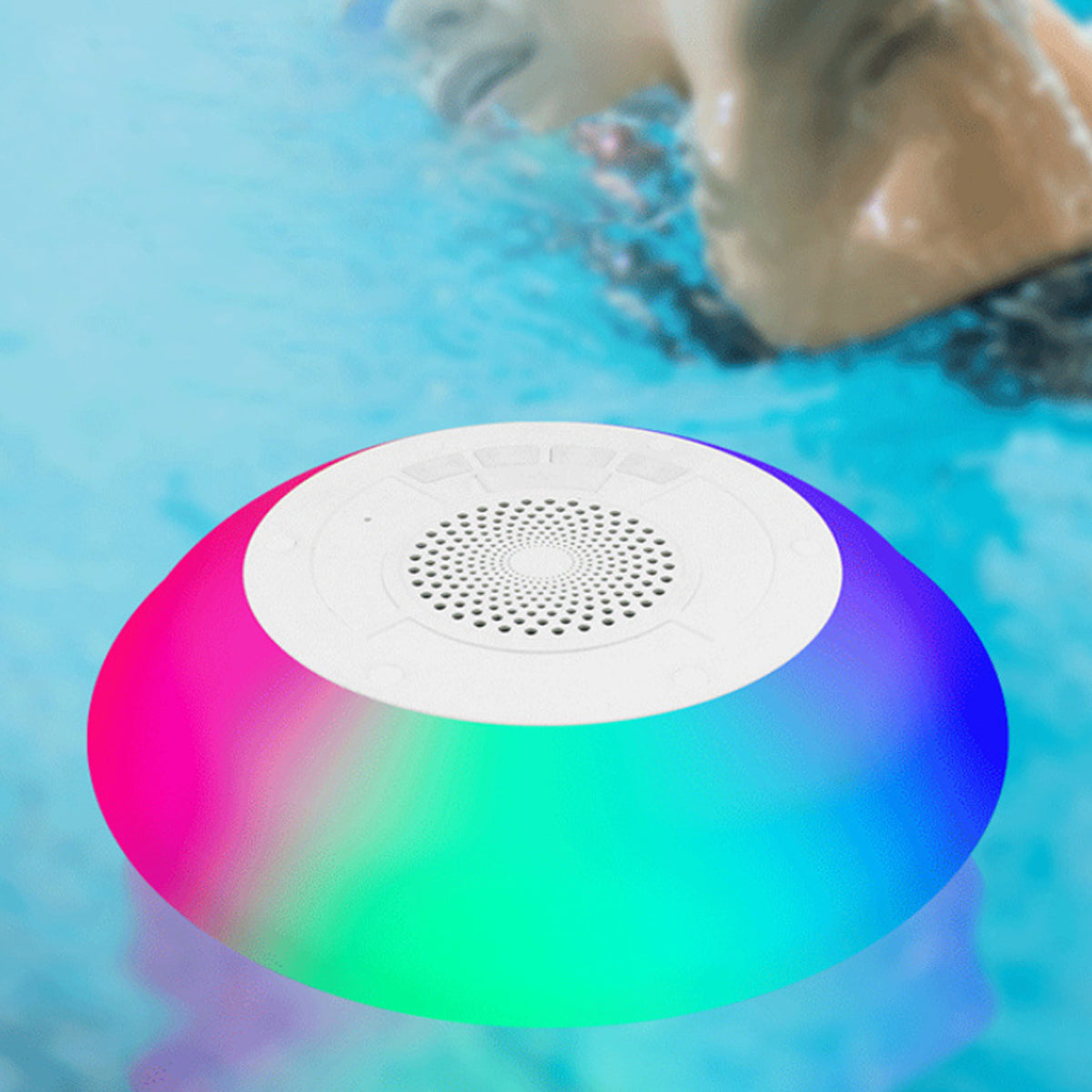 Colorful underwater speaker in a pool with a dog swimming in the background
