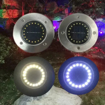 Four round LED lights in different colors on a natural background